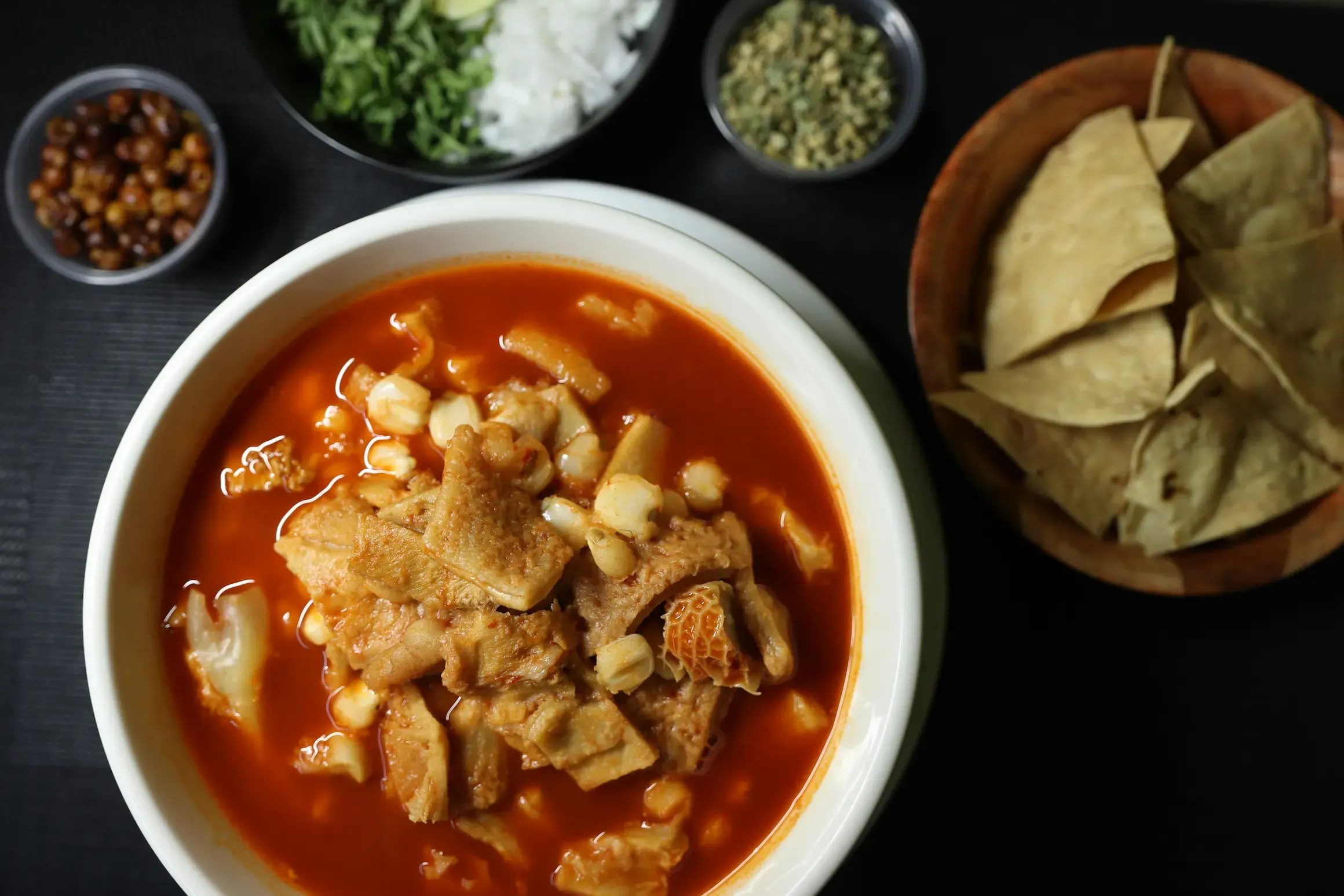 Pozole Rojo — Traditional red pozole, hominy, radish, oregano, chile de árbol.