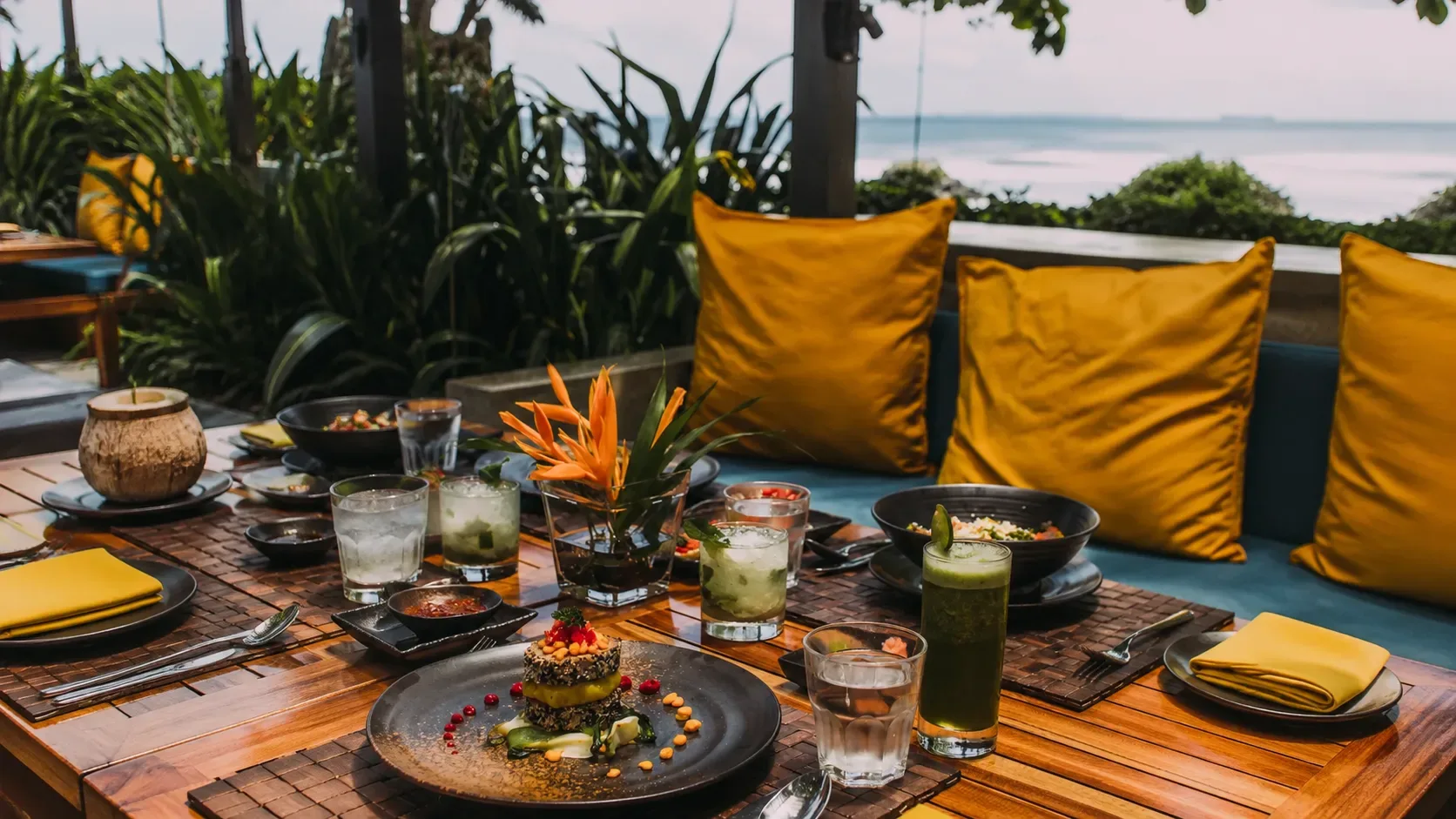Candlelit terrace table set with cocktails and a shared plate at Mexico De Noche