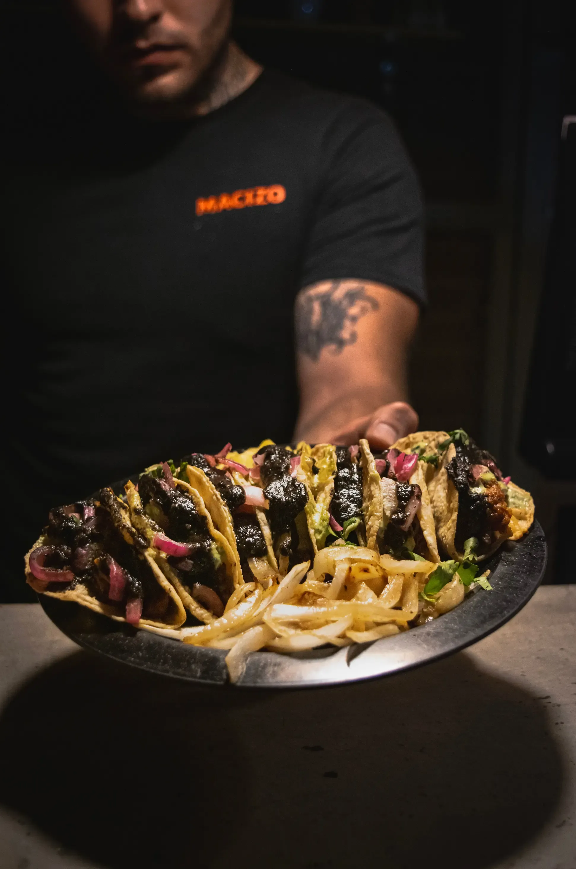 Tacos de Birria — Slow-braised birria, consommé for dipping, onion, cilantro.
